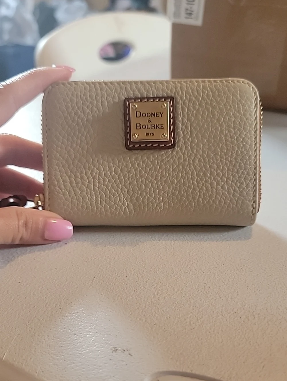 Dooney & Bourke  Pebbled Leather Zip-Around Wallet In Bone